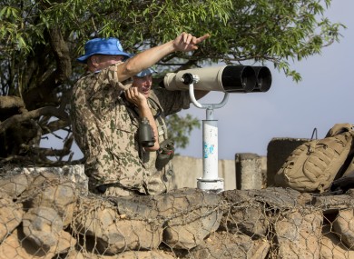 UN soldiers observe Syria's Quneitra province.