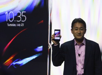 Sony CEO Kazuo Hirai with one of the company's Xperia smartphones.