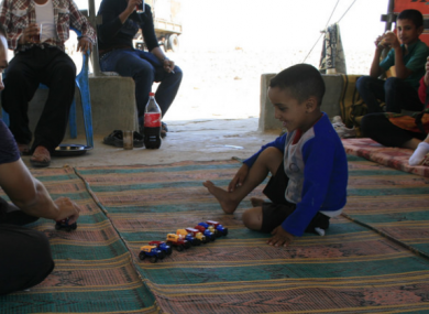 Al Rashiyda bedouin camp EA human rights observer and child.