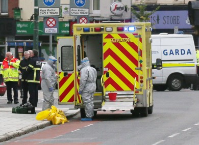 Workers in protective gear near the Mater Hospital yesterday.