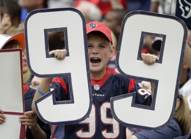 A young Houston Texans fan supporting his team.
