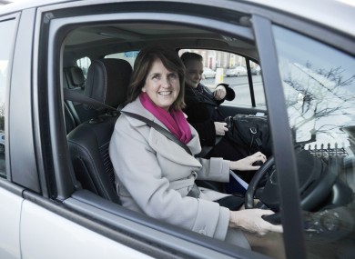 Joan Burton drives her own car to work in 2011.