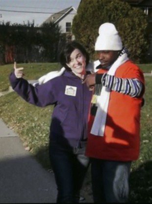 Minneapolis Mayor Betsy Hodges and Neighborhoods Organizing for Change employee Navell Gordon gesture while they knock on doors to get out the vote in north Minneapolis.