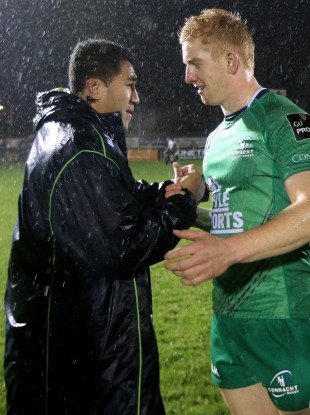 Fullback Leader is congratulated by Mils Muliaina.