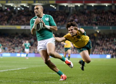 Simon Zebo races clear of Nick Phipps to score Ireland's first try.
