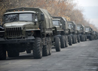 Unmarked military vehicles parked on a road outside the separatist rebel-held eastern Ukrainian town of Snizhne, 80 kilometres from Donetsk on Saturday .