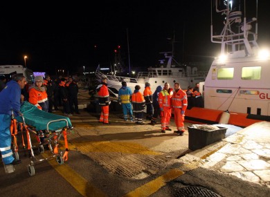 Paramedics wait for rescued passengers of the ferry that caught fire.