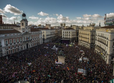 People arrive to the main square of Madrid during a Podemos (We Can) party march in Madrid.