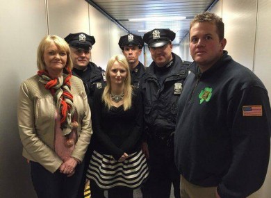 Police officers welcomed Hanrahan's mother Rosemary and wife Emma Holland when they arrived in the US.