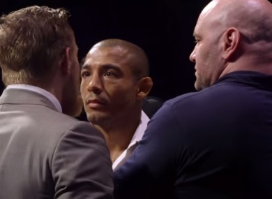 UFC president Dana White (right) keeps Conor McGregor and Jose Aldo apart during Friday's staredown in Rio.