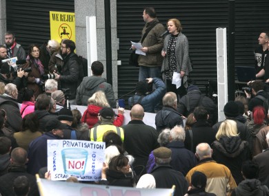 Protesters listen to Ruth Coppinger TD outside Irish Water's HQ.