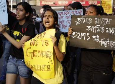 A girl shouts slogan as she participates in a walk protesting violence against women in Kolkata, India.