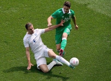 Brady battles for the ball with Jordan Henderson.