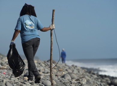 A Municipal worker searches Reunion Island beaches last week.