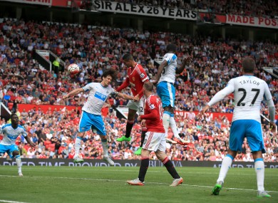 Chris Smalling (centre) sees a late header rebound off the post.