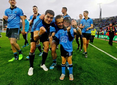 The Brogan brothers and Alan's son Jamie celebrate Dublin's victory.