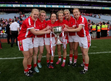 Geraldine O'Flynn (third from left) celebrates victory with her teammates.