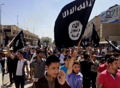 Demonstrators at a protest outside government headquarters in Mosul, 360 km northwest of Baghdad, Iraq (2014).