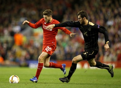 Rubin Kazan's Solomon Kvirkvelia (right) and Liverpool's Adam Lallana battle for the ball.