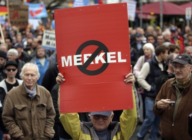People take part in a protest rally of the German party 'Alternative fuer Deutschland, AfD' (Alternative for Germany) in Berlin.