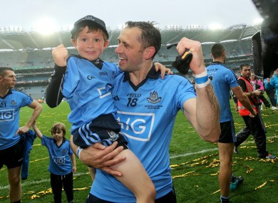 Dublin's Alan Brogan celebrates with his son Jamie after winning the All-Ireland earlier this year.