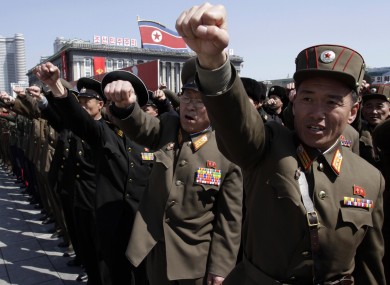 North Korean army officers punch the air as they chant slogans during a rally in Pyongyang.