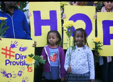 Stephanie Nganga aged 5 and Tatiana Nganga aged 8 taking part in a moment of silence for victims of Direct Provision by asylum seekers at a demonstration last year.