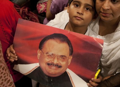 Supporters of MQM holding a picture of Altaf Hussain in Islamabad