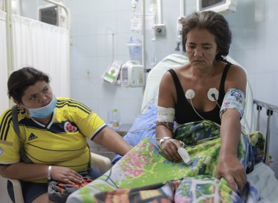 Zuleidy Balza, left, sits with her mother Zulay Balza who's recovering from Guillain-Barre syndrome.