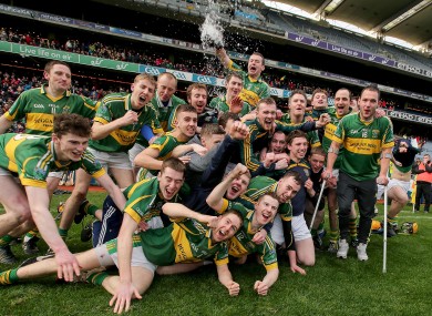 Ger Aylward (right) in crutches with his Glenmore teammates as they celebrate their All-Ireland win in Croke Park today.