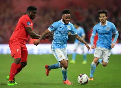 Liverpool's Kolo Toure (left) and Manchester City's Raheem Sterling battle for the ball during the Capital One Cup final.