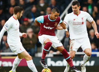 Dimitri Payet competing against Liverpool.