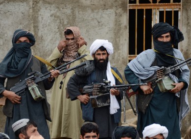 Afghan Taliban fighters listening to Mullah Mohammed Rasool, the newly-elected leader of a breakaway faction of the Taliban, in Farah province back in November 2015.