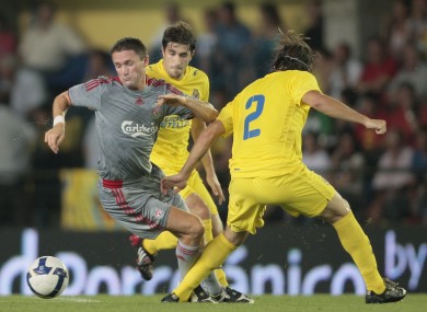 Robbie Keane facing Villarreal's Cani and Gonzalo Javier back in 2008.