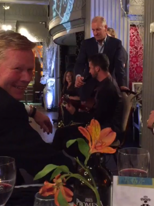 Long on stage with Koeman smiling.
