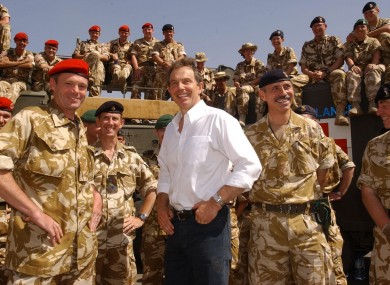 File photo dated 29/05/03 of former Prime Minister Tony Blair meeting troops in the port of Umm Qasr, Iraq.
