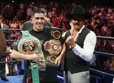 Santa Cruz celebrates his featherweight title win against Abner Mares in August 2015.
