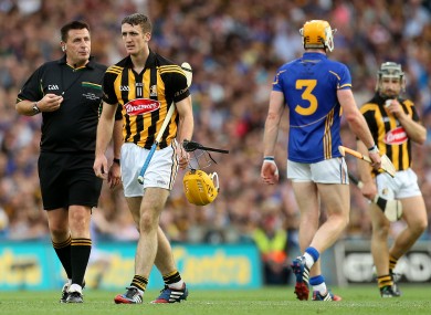 Referee Brian Gavin with Kilkenny's Colin Fennelly and Tipperary's Padraic Maher during the 2014 final replay.