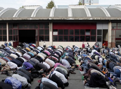 File: French Muslims attend Friday prayers at a disused former fire station converted into a prayer hall near Paris.