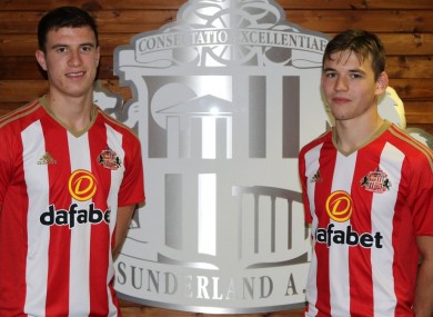 McNair and Love pose in Sunderland shirts.