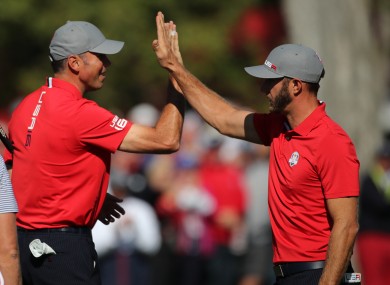 Matt Kuchar and Dustin Johnson celebrate their victory.