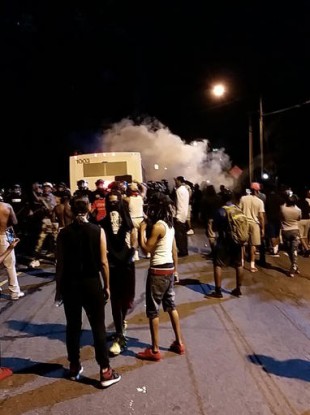 Police fire tear gas into the crowd of protesters on Old Concord Road in Charlotte.