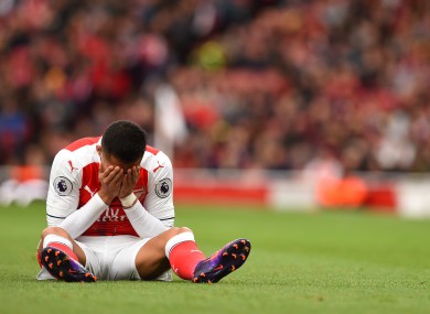 Arsenal's Alexis Sanchez holds his head in his hands at the Emirates today.