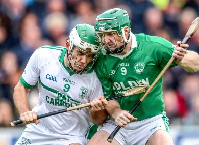 Paddy Deegan and Henry Shefflin in action.