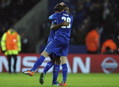 Wes Morgan and Leicester's Christian Fuchs celebrate after winning the Champions League Group G soccer match between Leicester City and Club Brugge.