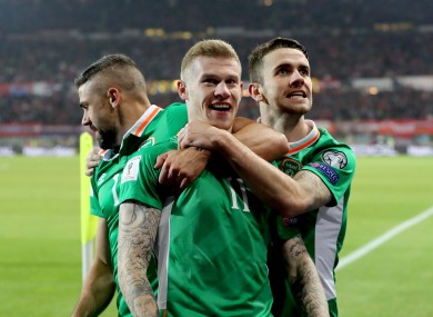 McClean is hugged by Brady and Walters after his goal.