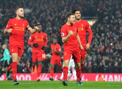 Liverpool's James Milner celebrates scoring his side's second goal.