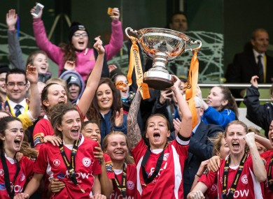 Shelbourne Ladies' Pearl Slattery lifts the trophy.