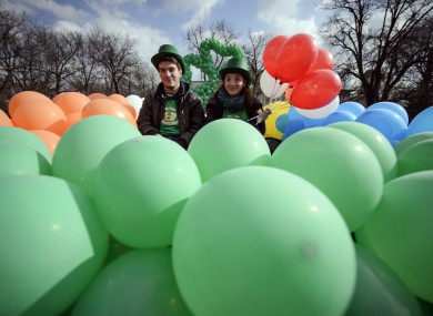 A couple poses during the St Patrick's Day parade in Bucharest, Romania.