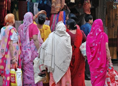 Women in saris, traditional Indian dress.